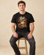 Model seated But First Coffee T-shirt in Black