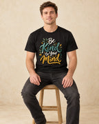 Model seated Be Kind To Your Mind T-shirt in Black