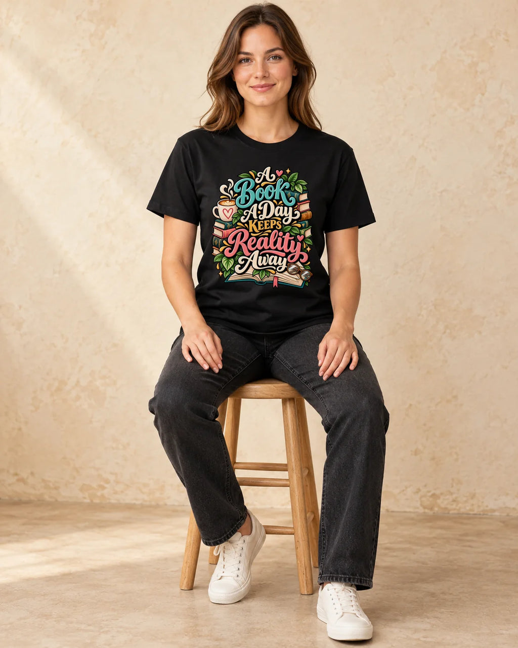 Model seated A Book A Day Keeps Reality Away T-shirt in Black