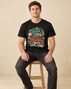Model seated A Book A Day Keeps Reality Away T-shirt in Black