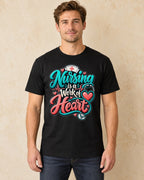 Model standing Nursing Is A Work Of Heart T-shirt in Black