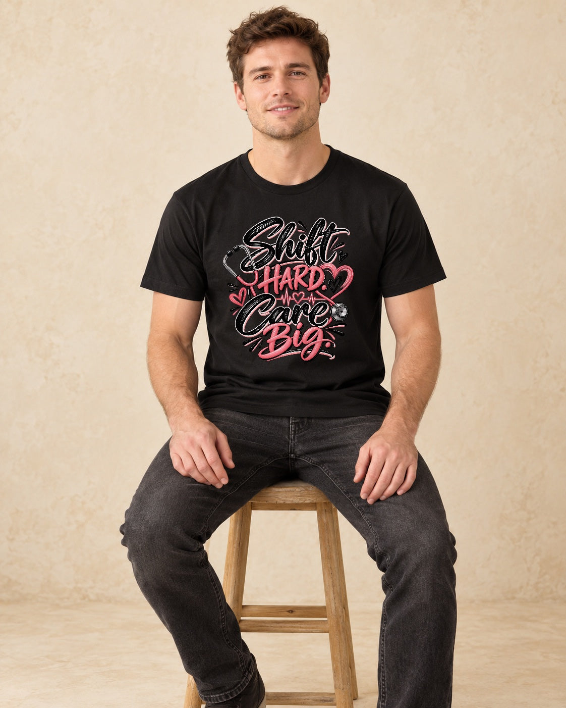 Model seated Shift Hard Care Big T-shirt in Black