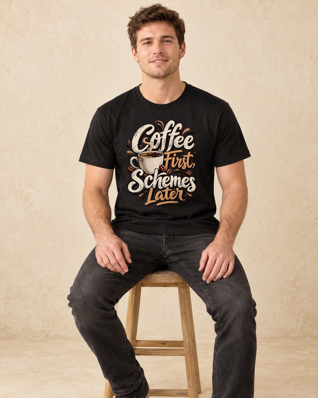 Model seated Coffee First Schemes Later T-shirt in Black