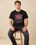Model seated Heart Of The Hospital T-shirt in Black
