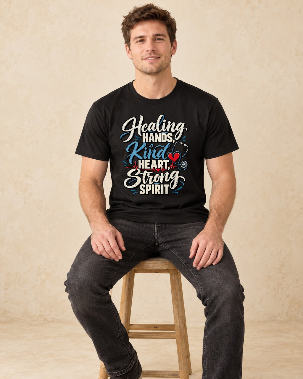 Model seated Healing Hands Kind Heart Strong Spirit T-shirt in Black